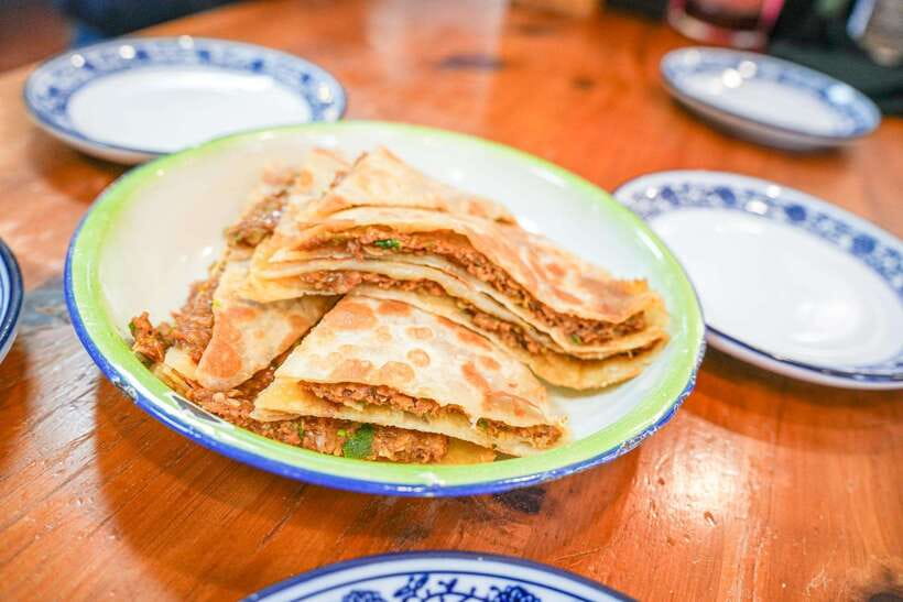 Beijing: Hutong Breakfast Food Tour - Stop 5: Mr. Yu’s Beef Flatbread and Tofu Pudding