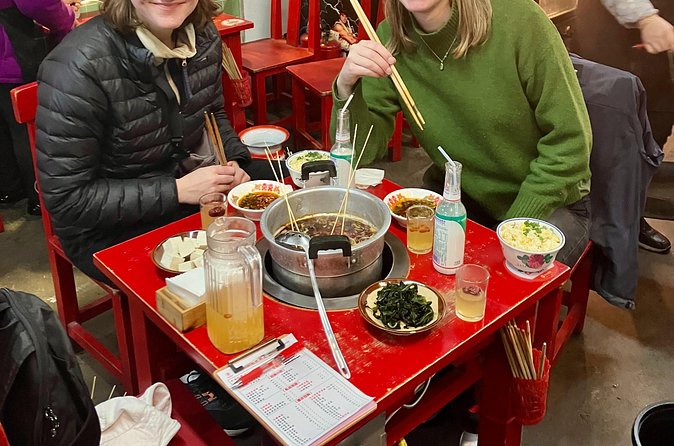 discovery more Beijing back street evening food tour with locals - Huguosi Hutong Snack Street: where the eating becomes the plan
