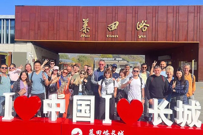 MuBus: Mutianyu Great Wall ENG/ESP/RUS Guided Bus Tour - The Bus Ride: Multilingual Guide, Tea, and Setup Talk